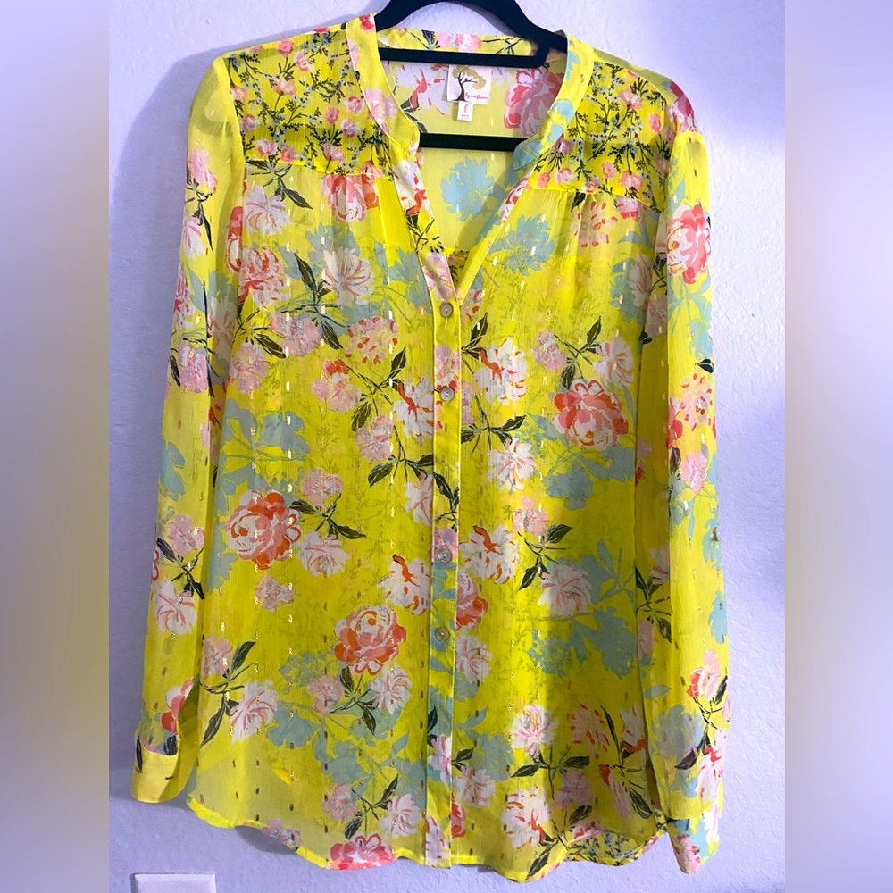 Yellow button down blouse.